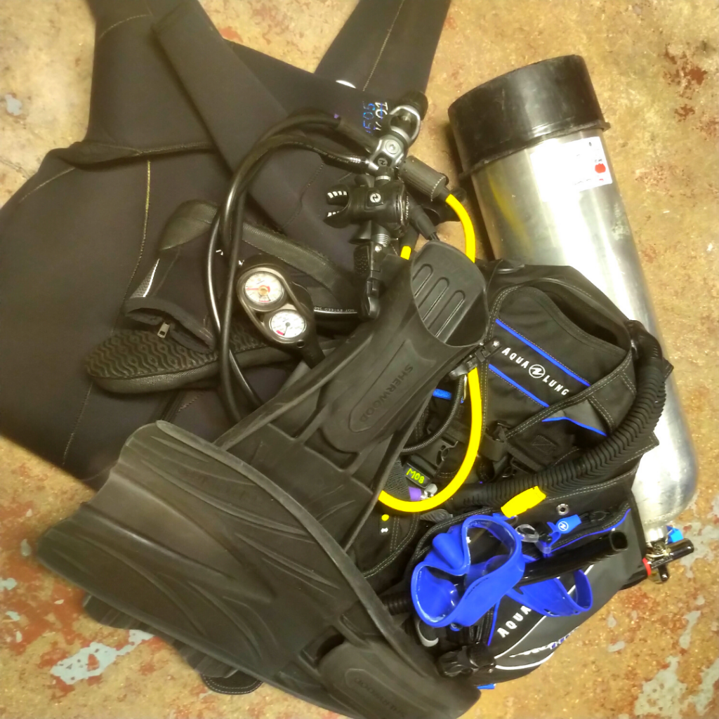scuba equipment gear messed up on floor